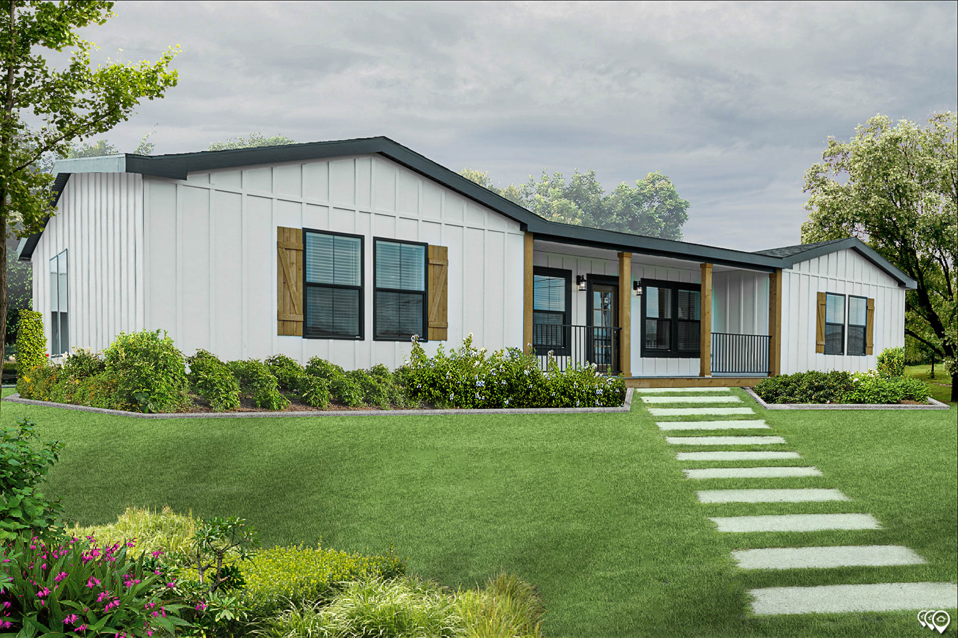 A modern white prefab home with black trim sits amidst lush greenery. It has brown shutters, a welcoming porch, and a stepping-stone path on a manicured lawn.