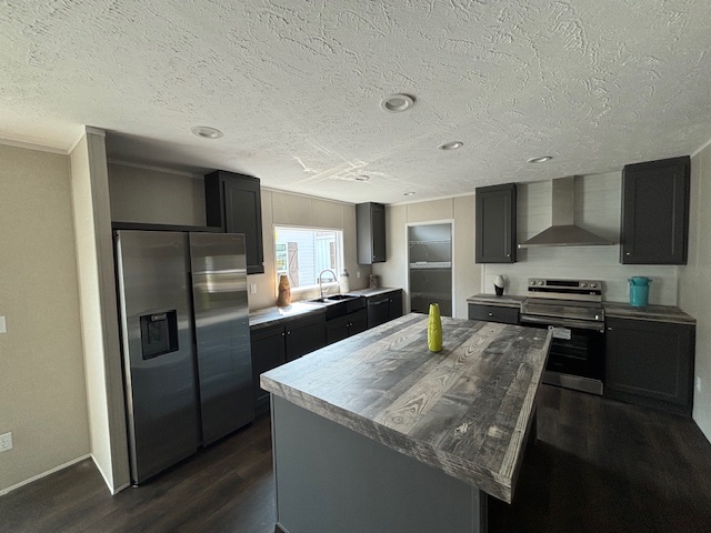 Modern kitchen with a large wooden island, stainless steel appliances, and dark cabinets. A bright window illuminates the space. Cozy and elegant.