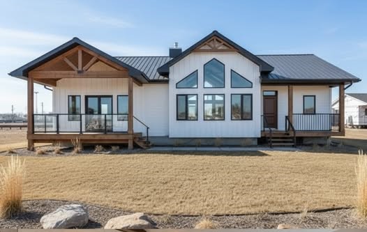 A modern, single-story house with a gabled roof and large windows. The cozy interior features an open-plan living area with wooden floors and neutral decor.