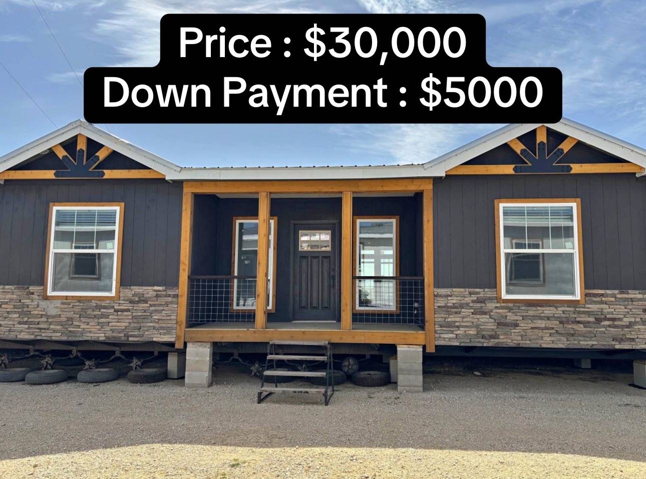 Single-story modular home with stone and wood accents, front porch, and steps. Price: $30,000, Down payment: $5,000 in bold text above.